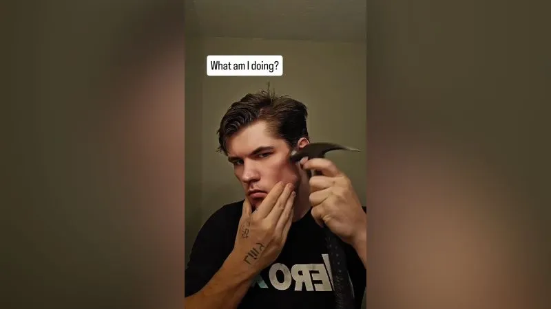 A social video still captioned "What am I doing?", showing a man holding a hammer against his cheekbone - the bonesmashing practice AstroSky says he does not condone.