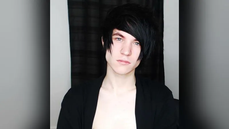 AstroSky as a teenager, with a long black fringe and pale skin, before the skincare work described in this interview.